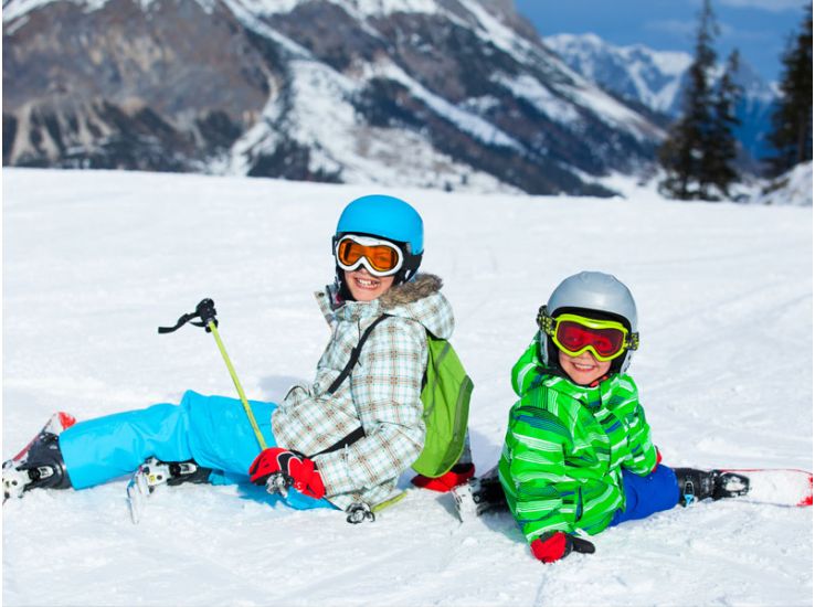 Kids sitting in snow