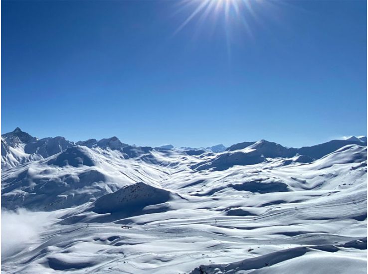 sun snow mountains